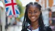 education, travel and people concept - smiling african american girl with british flag in city