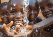 African children enjoy clean water