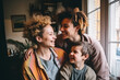 © paffy - A heartwarming family scene with a smiling mother embracing her two joyful children indoors, near a window