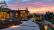 Capture a side view of a Modern Suburban Craftsman Style House at sunset. The pathway to the house is illuminated by landscape lighting, creating a warm and welcoming effect against the twilight sky.