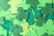 canvas print picture - St. Patrick's day. Decorative clover leaves on green background, top view