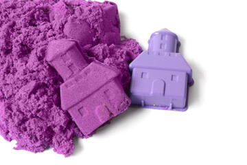 Poster - Castle made of purple kinetic sand and plastic mold on white background, top view