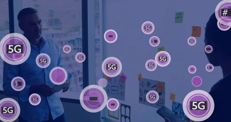 Poster - Animation of 5g icons over diverse colleagues brainstorming at casual office