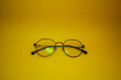 © Andri - retro eyewear with yellow background. classic eyeglass. vintage sunglasses.