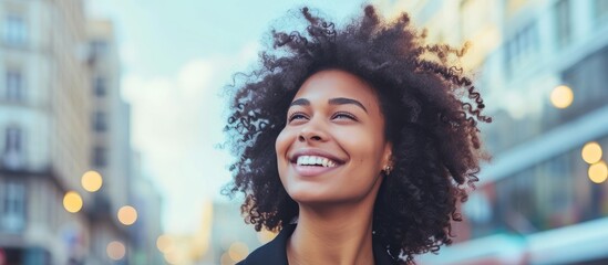 Poster - a woman with curly hair is smiling in front of a city street . High quality