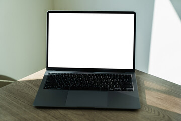 Poster - laptop with white screen on office desk blank copy space screen for your advertising text message