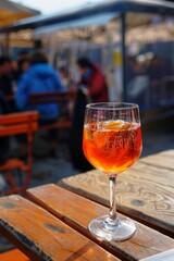 Poster - Glass of spritz cocktail on wooden table