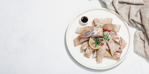 Wall Mural - Raw pollock (Pollachius virens) fillet. Fresh fish for healthy food lifestyle. Spices and herbs