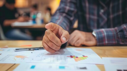 Poster - Image of male hand pointing at business document during discussion at meeting