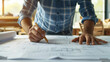 © Blackmint Studio - close up of a person working on a blueprint