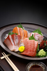 Wall Mural - assorted sashimi; tuna(medium fatty), salmon, yellowtail, and sea bream. authentic Japanese dining. copy space.