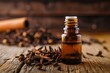 Clove essential oil on a wooden surface