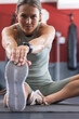 © Wavebreak Media - Fit young Caucasian woman stretches at the gym