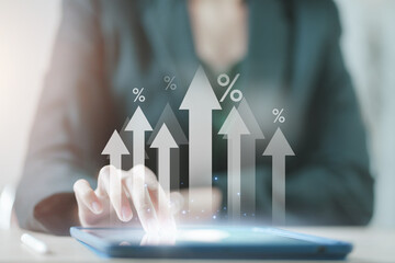 Interest rate and dividend, Businessman hold up arrow icon and percentage with graph indicators for investment growth. business financial investment, business growth, income, marketing and profit.