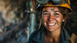 Portrait of a young adult smiling female mine worker with a dirty face. International Women's Day concept.