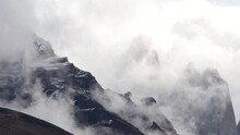 Time Lapse View On Moving White Clouds Hiding And Showing The Top Of Mountains In Torres Del Paine Park. High Quality FullHD Footage