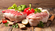 raw roast beef and veal on wood background
