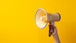 A woman's hand holds a yellow megaphone on a yellow background which is symbol of advertising, PR and promotion, Alert, announcement, warning and advertising concept, Copy space, Generative AI.