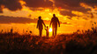 Silhouette of a family walking in the field at sunset