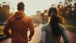 Portrait of beautiful couple jogging together  running and exercising in a park outdoors