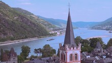 Top View Of Medieval German City Of Bacharach, Postenturm, Wide Waters Of Rhine River, Valley Among Luxurious Vineyards, Wine Tourism In Rhineland-Palatinate, Points Of Interest And Landmarks