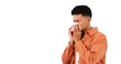 © Heyt/peopleimages.com - Man, sneezing for allergies and sick with tissue for runny nose isolated on png transparent background. Cold, flu or covid with bacteria virus, influenza and illness with toilet paper for sinus