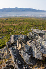 Wall Mural - View of rocks and mountains. A town in the distance among the mountains. Travel and hiking.