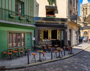 Wall Mural - typical view of street with tables of cafe in paris, france. cozy cityscape of paris. architecture a