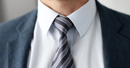 Male neck in blue suit with tie. Male dress code in business concept