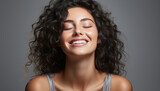 Fototapeta Miasto - Young woman with curly brown hair smiling, looking at camera generated by AI