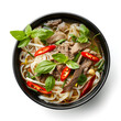 Pho Bo Vietnamese soup with beef and rice noodles on a white background, top view, close-up