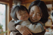 © 성현 김 - mom and her child are laughing and hugging each other