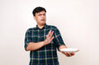 © ArvStd - Portrait of young asian man showing rejection hand gesture with food on a plate