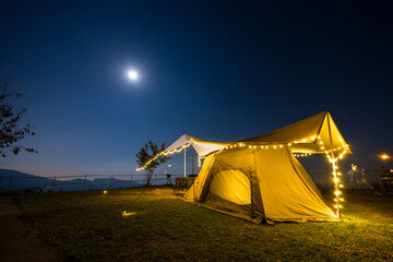 Canvas Print - Outdoor camping tent with tarp or flysheet over mountain