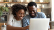 © Intelligent Horizons - Happy african young couple use laptop planning with bills and paying bill, credit card, finance, money, business and online banking, financial managing budget and accounting concept