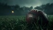 American football ball on a playing field at night in high resolution