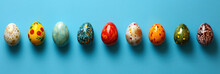 Easter Eggs Arranged In A Random Order On Blue Background With Copy Space, Each Egg Featuring Its Own Unique Pattern And Color