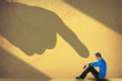 © Rob Goebel - The finger of blame is pointed at this guy in a shadowy 3-d illustration.