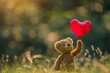 Cute teddy bear holding a red heart balloon amidst the beauty of nature. Expressing love on Valentine's Day with a romantic gesture. Blurred natural background adds to the charm.