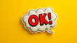 ok word in comic speech bubble style with explosion in pop art on trendy yellow background