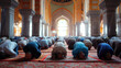 Muslim men in prostration during prayer in a mosque at sunset Muslim men praying in Mosque interior.