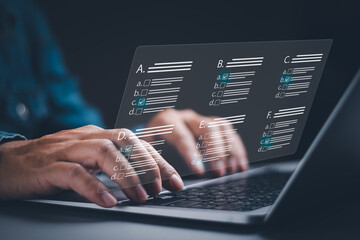 Poster - man's hand is selecting the correct answer to make an evaluation or answering exam questions with virtual screen on laptop computer, concept of Online surveys, assessments, online forms and exam