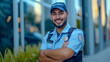 © MP Studio - smiling security guard with a beard, standing confidently with his arms crossed
