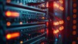 © Thanaphon - Close-up of network server equipment with glowing fiber optic cables in a modern data center.