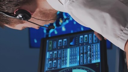 Wall Mural - Workplace of the air traffic controllers in the control tower. Team of professional aircraft control officers works using radar, computer navigation and digital maps.