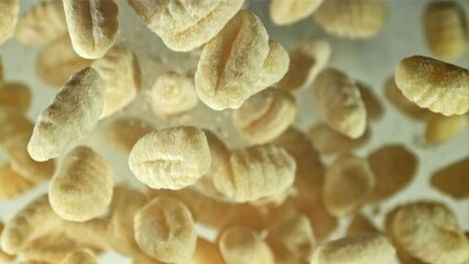 Poster - Gnocchi fly up and fall down. Filmed on a high-speed camera at 1000 fps. High quality FullHD footage