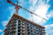 © ungvar - Tower crane construction for the building under construction site Generative AI