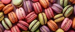 Full frame image of many colorful French macaroons from directly above. banner, background.