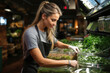 © ADDICTIVE STOCK - Smiling female employee arranging fresh greens at deli Generative AI image