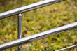metal handrail with raindrops, shot with shallow depth of field.